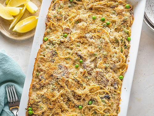 Fully cooked tuna tetrazzini with a browned breadcrumb topping in a large rectangular baking dish.