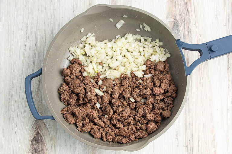 Ground beef and onion in large skillet.