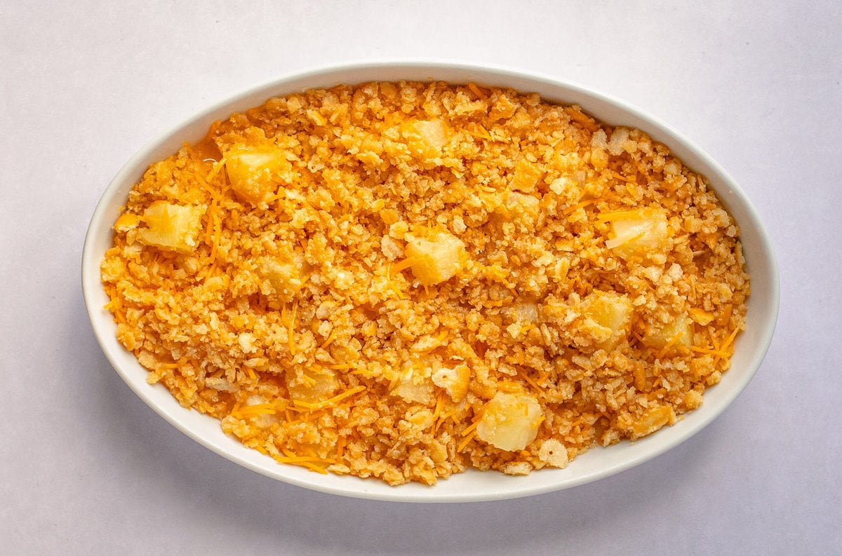 Pineapple casserole topped with crumbled Ritz crackers.