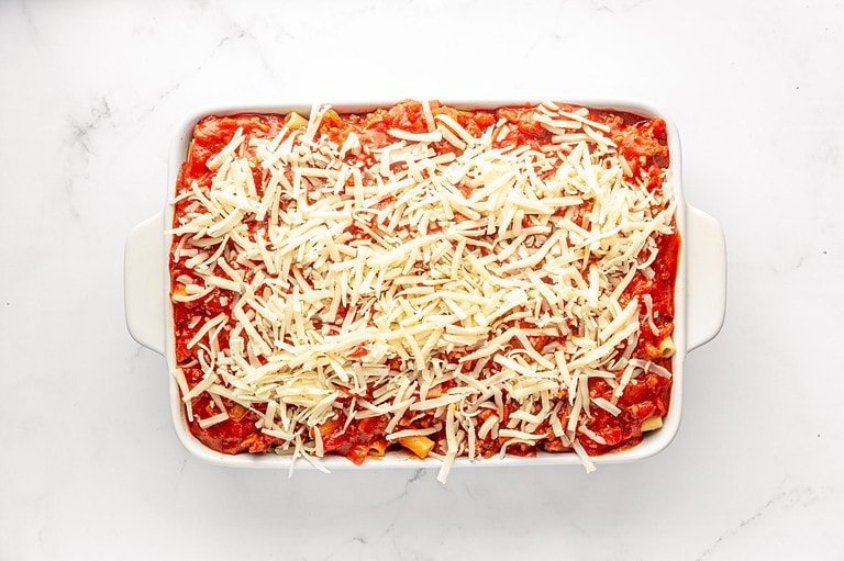 Layered ziti, meat sauce, and ricotta filling topped with mozzarella.