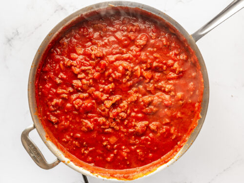 Marinara meat sauce in a large silver skillet.