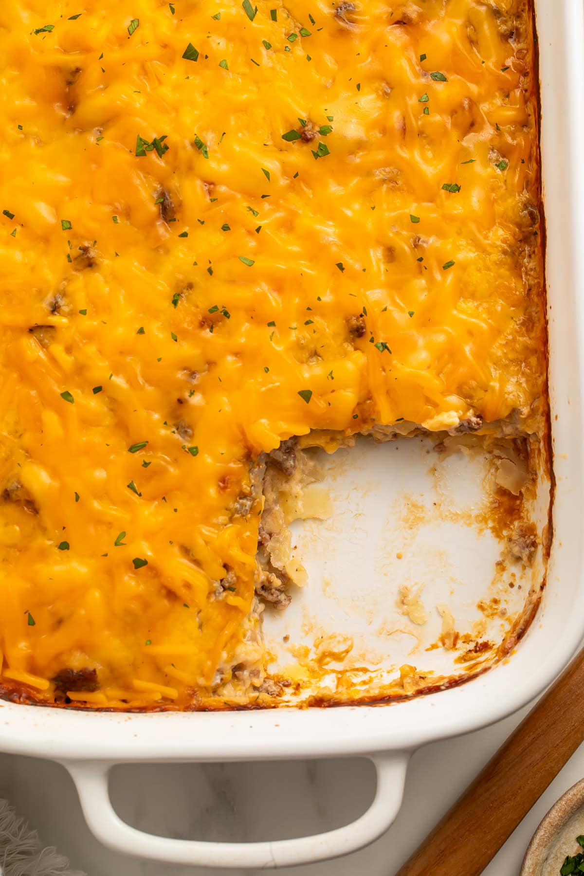 Close up of a hobo casserole with a portion taken out of the corner.