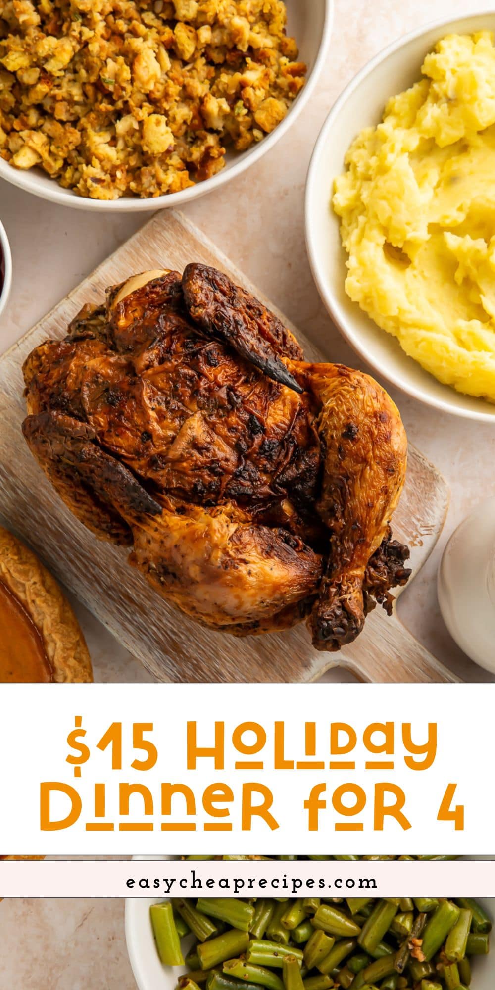 Close up of a roast chicken with holiday sides arranged around the side with Pinterest text overlay.